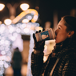 Woman drinking coco outside