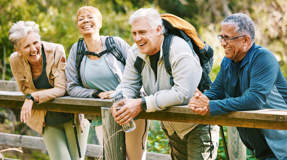 Elderly, people hiking and happy in park.